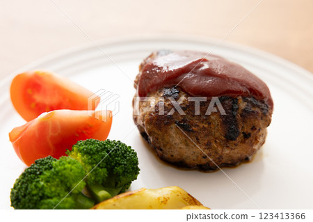 Hamburger served on a white plate 123413366