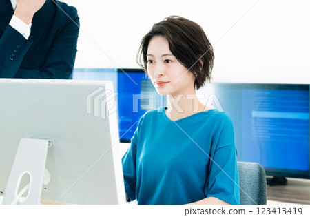Businesswoman receiving advice from her boss Businesswoman receiving advice from her boss 123413419