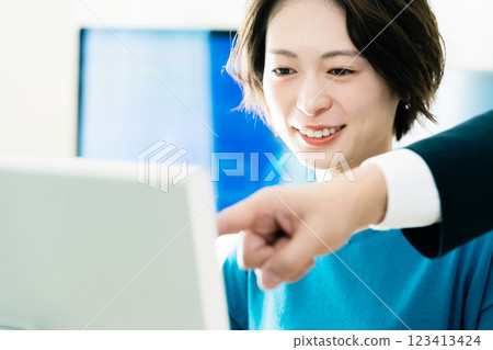 Businesswoman receiving advice from her boss Businesswoman receiving advice from her boss 123413424
