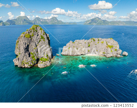 Twin Rocks under blue sky and clouds. El Nido, Palawan. Philippines. Twin Rocks under blue sky and clouds. El Nido, Palawan. Philippines. 123413552