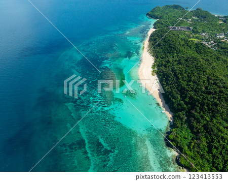 Transparent turquoise sea waters with coral reefs in Puka Shell Beach. White sands in Boracay, Philippines. 123413553