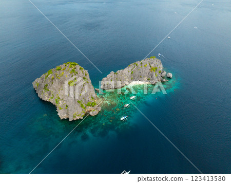 Blue sea with boats around Twin Rocks. El Nido, Palawan. Philippines. 123413580