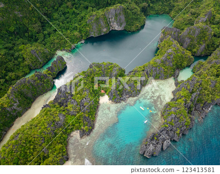 Big and Small Lagoons with kayaks over clear water. Miniloc Island. El Nido, Palawan. Philippines. Big and Small Lagoons with kayaks over clear water. Miniloc Island. El Nido, Palawan. Philippines. 123413581
