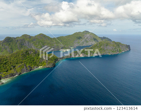 Tapiutan and Matinloc surrounded by blue sea. Islands in El Nido, Palawan. Philippines. Tapiutan and Matinloc surrounded by blue sea. Islands in El Nido, Palawan. Philippines. 123413614