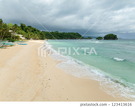 Inshore ocean waves crashing on white sand in Ilig Iligan Beach. Boracay, Philippines. 123413616