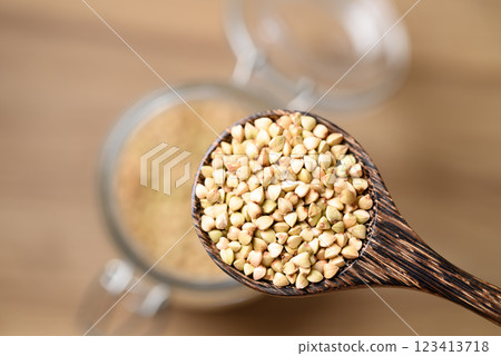Organic buckwheat seed in wooden spoon, Food ingredient 123413718