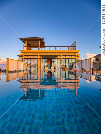 Sunset views from overwater pool villa in Maldives 123414651