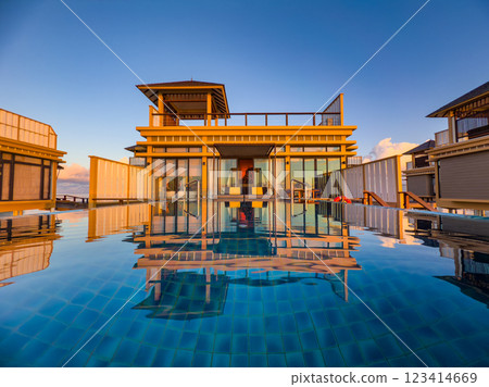 Sunset views from overwater pool villa in Maldives Sunset views from overwater pool villa in Maldives 123414669