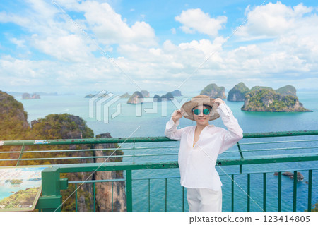 Woman tourist traveling in Krabi, Thailand. happy traveller enjoy and sightseeing view at koh Hong island viewpoint. summer trip, destination, Southeast Asia Travel, vacation and holiday concept 123414805
