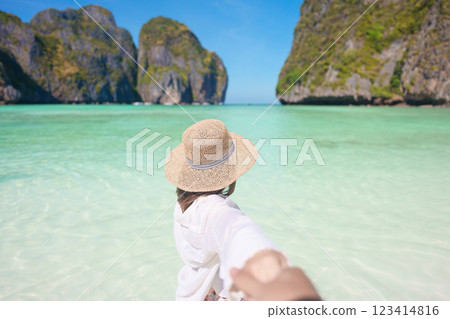 Couple tourist traveling and sightseeing in Krabi, Thailand. happy traveller enjoy at Maya Bay beach on Phi Phi island. Honeymoon trip, destination, Southeast Asia Travel, vacation and holiday concept Couple tourist traveling and sightseeing in Krabi, Thailand. happy traveller enjoy at Maya Bay beach on Phi Phi island. Honeymoon trip, destination, Southeast Asia Travel, vacation and holiday concept 123414816