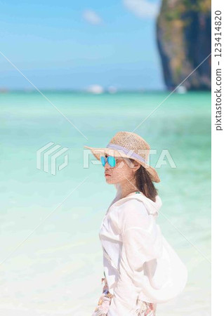 Woman tourist traveling and sightseeing in Krabi, Thailand, happy traveller enjoy at Maya Bay beach on Phi Phi island, Popular paradise island, destination, Southeast Asia Travel, vacation and holiday 123414820