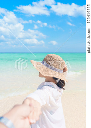couple tourist relaxing and enjoying on beach, happy traveller looking beautiful sea view on tropical island. Honeymoon, tropical destination, southeast Asia Travel, summer vacation and wanderlust 123414835