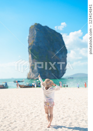 Woman tourist traveling and sightseeing in Krabi, Thailand. happy traveller enjoy on beach at Koh Poda island. summer trip, destination, Southeast Asia Travel, vacation and holiday concept Woman tourist traveling and sightseeing in Krabi, Thailand. happy traveller enjoy on beach at Koh Poda island. summer trip, destination, Southeast Asia Travel, vacation and holiday concept 123414841