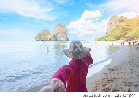 couple tourist travel and sightseeing in Krabi, Thailand. happy traveller enjoy on beach at Phra nang Cave Beach near Railay Beach. Honeymoon, tropical destination, Travel and summer vacation concept 123414844