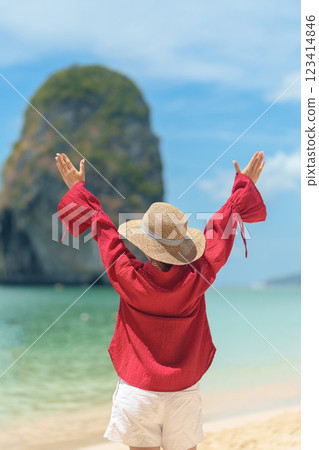 Woman tourist travel and sightseeing in Krabi, Thailand. happy traveller enjoy on beach at Phra nang Cave Beach near Railay Beach. summer trip, destination, Southeast Asia Travel and vacation concept 123414846