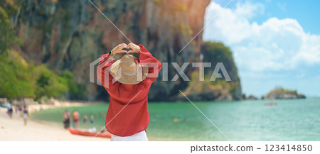 Woman tourist travel and sightseeing in Krabi, Thailand. happy traveller enjoy on beach at Phra nang Cave Beach near Railay Beach. summer trip, destination, Southeast Asia Travel and vacation concept 123414850
