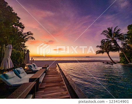 Sunset views from overwater pool villa in Maldives 123414901