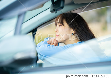 Car and driver Woman driving a car Woman in a car 123415038