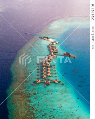 Aerial views of Velavaru Island at sunset in Maldives Aerial views of Velavaru Island at sunset in Maldives 123415116