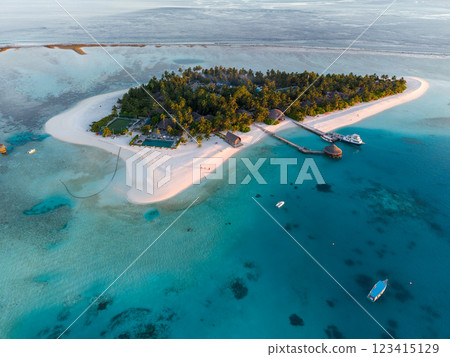 Aerial views of Velavaru Island at sunset in Maldives Aerial views of Velavaru Island at sunset in Maldives 123415129