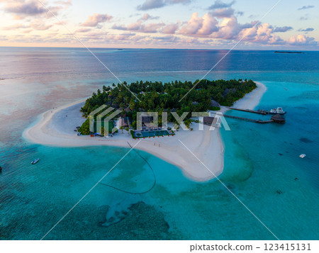 Aerial views of Velavaru Island at sunset in Maldives Aerial views of Velavaru Island at sunset in Maldives 123415131
