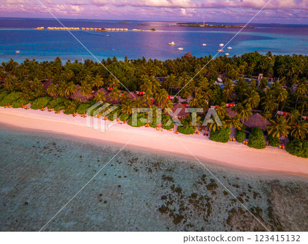 Aerial views of Velavaru Island at sunset in Maldives Aerial views of Velavaru Island at sunset in Maldives 123415132