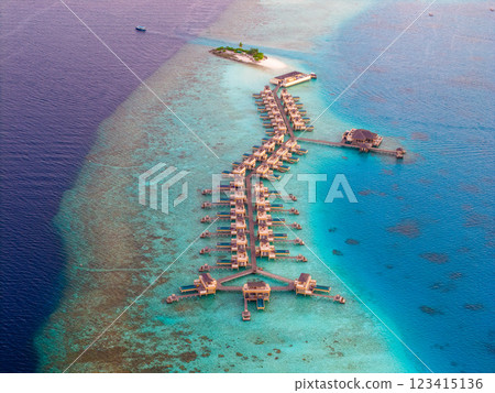 Aerial views of Velavaru Island at sunset in Maldives 123415136