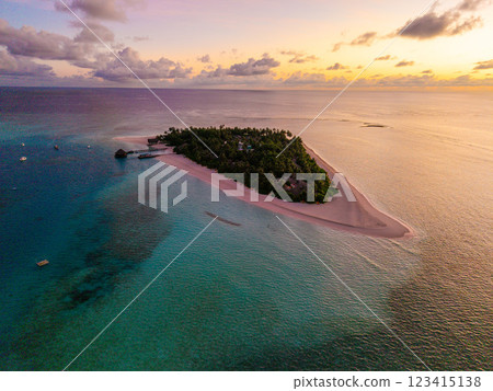 Aerial views of Velavaru Island at sunset in Maldives 123415138