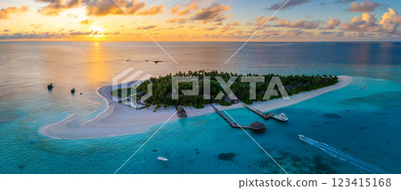 Aerial views of Velavaru Island at sunset in Maldives 123415168