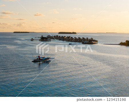 Aerial views of Velavaru Island at sunset in Maldives 123415198