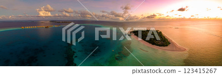 Aerial views of Velavaru Island at sunset in Maldives 123415267