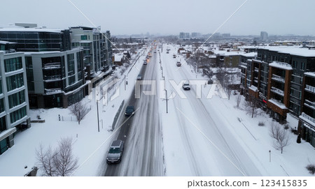 dense blizzard in modern city, traffic halted by snow 123415835