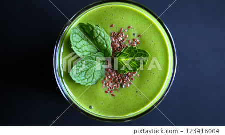 Creamy green smoothie with avocado, spinach, and mint leaves for freshness 123416004