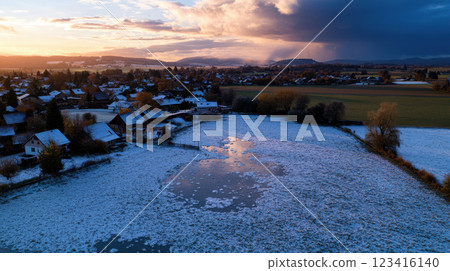 serene countryside landscape with snowy lake and distant hills serene countryside landscape with snowy lake and distant hills 123416140