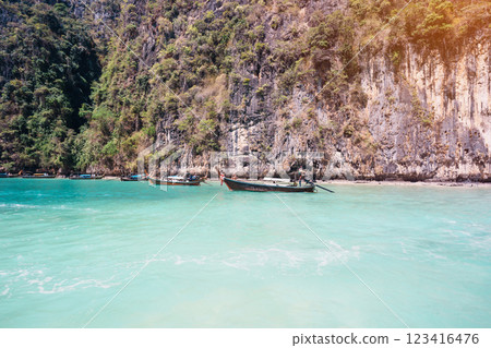 Long tail boat and speedboat at Pileh lagoon on Phi Phi island, Krabi, Thailand. landmark, destination Southeast Asia Travel, vacation and holiday conceptLong tail boat and speedboat at Pileh lagoon 123416476