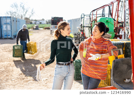 Women agriculturists having conversation outdoors 123416990