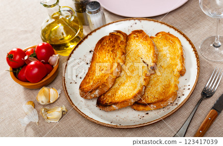 Sliced tomatoes on toasted bread Sliced tomatoes on toasted bread 123417039