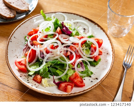 Fresh vegetable salad with tomatoes and onions Fresh vegetable salad with tomatoes and onions 123417140