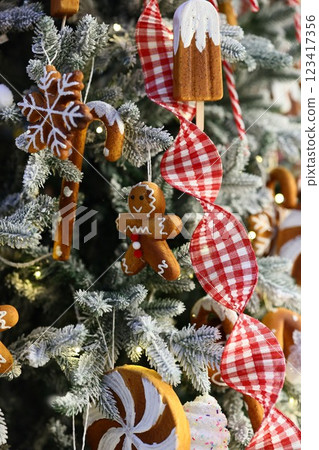Beautifully Festive Christmas Tree Decorations Featuring Gingerbread and Colorful Candy Canes 123417356