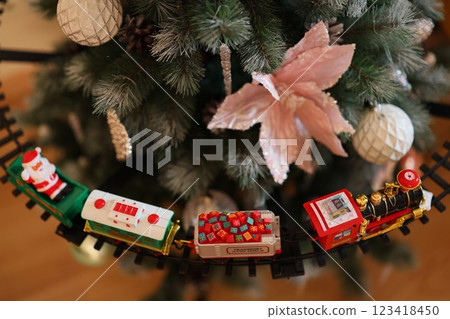 A Beautiful Festive Train Decoration Lining the Base of the Christmas Tree This Year A Beautiful Festive Train Decoration Lining the Base of the Christmas Tree This Year 123418450