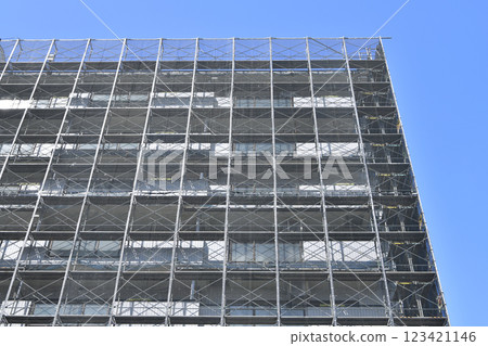 Yokohama cityscape in Japan - View of scaffolding and protective netting set up for repairs and inspections of apartment buildings (Yokohama city) Yokohama cityscape in Japan - View of scaffolding and protective netting set up for repairs and inspections of apartment buildings (Yokohama city) 123421146