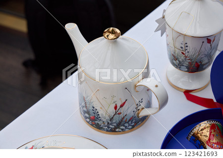 An Elegant and Beautiful Decorative Teapot Featuring a Stunning Floral Design with Gold Accents 123421693