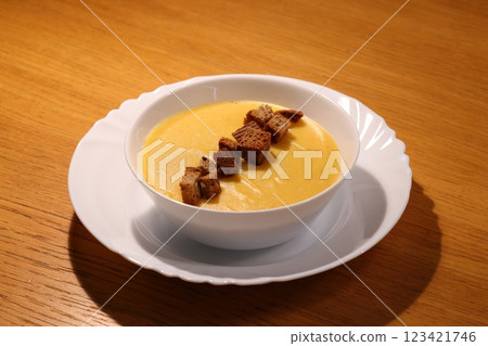 Enjoy a Deliciously Creamy Pumpkin Soup with Croutons Perfect for Any Autumn Day 123421746