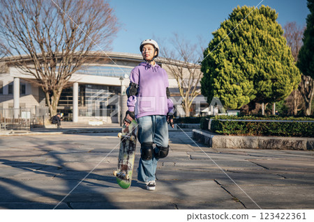 Portrait of a woman wearing skateboard protectors 123422361