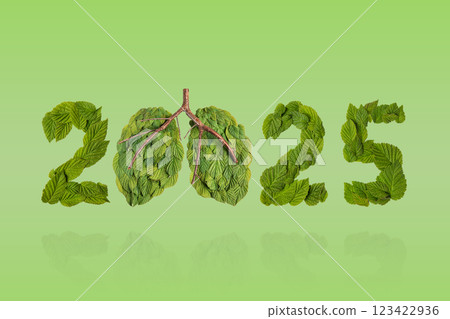 Green leaves in the shape of numbers 2025 and the lungs on a green background. New Year 2025 save it earth environment and our planet. Earth day 2025 concept and green recycling 123422936