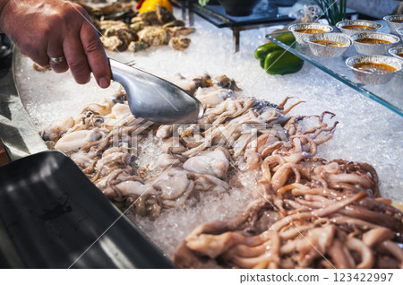 seafood in Asian buffet at hotel in the Asian breakfast restaurant. Chilled fresh octopus and squid on ice at night market in Vietnam 123422997
