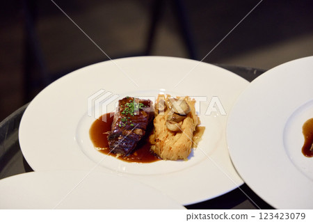 A Gourmet Dish featuring Tender, HighQuality Meat accompanied by a Delicate Puree A Gourmet Dish featuring Tender, HighQuality Meat accompanied by a Delicate Puree 123423079