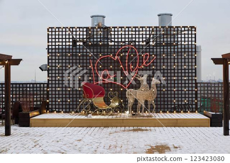 A beautifully festive winter rooftop scene adorned with a charming sleigh and delightful decorations 123423080