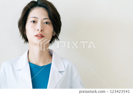 A woman in a white coat A woman in a white coat 123423541