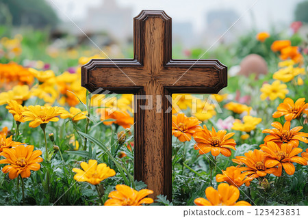 A wooden cross surrounded by vibrant flowers 123423831
